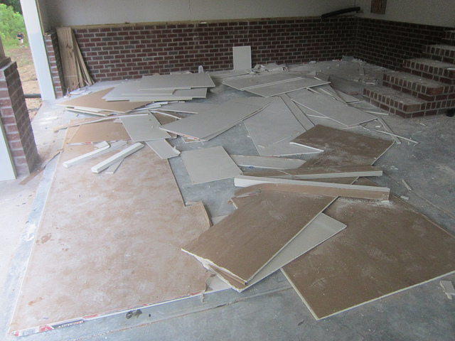 drywall scattered on the floor